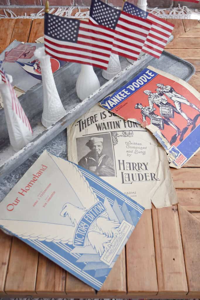 Vintage patriotic sheet music as centerpiece.