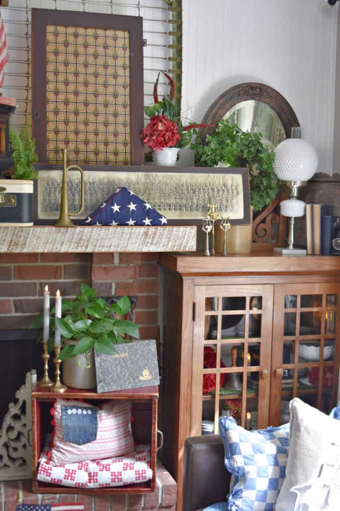 Vintage Patriotic decorated mantel with red, white and blue thrifted finds.