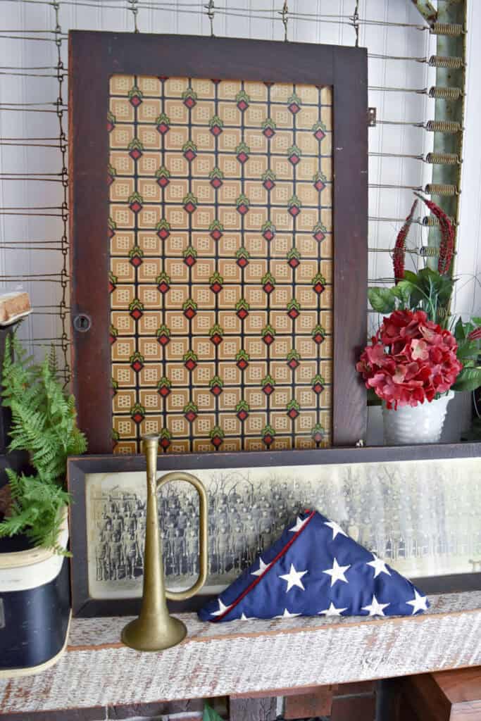 Antique patterned glass door and vintage army decor.