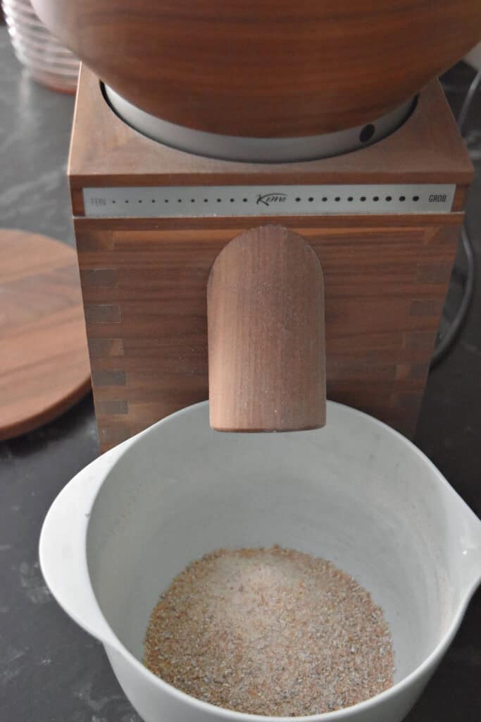 Komo classic grain mill and freshly milled flour.