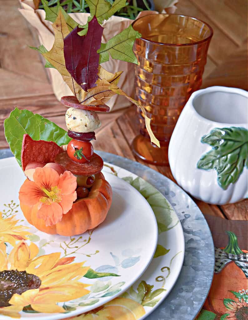 Mini pumpkin charcuterie on Fall table setting.