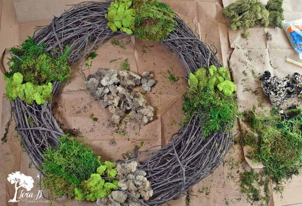 Crafting a mixed moss grapevine wreath