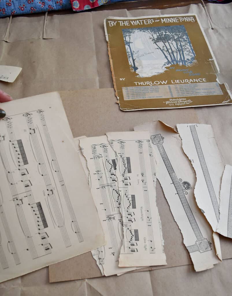 Crafting vintage sheet music into upcycled art with modge podge.