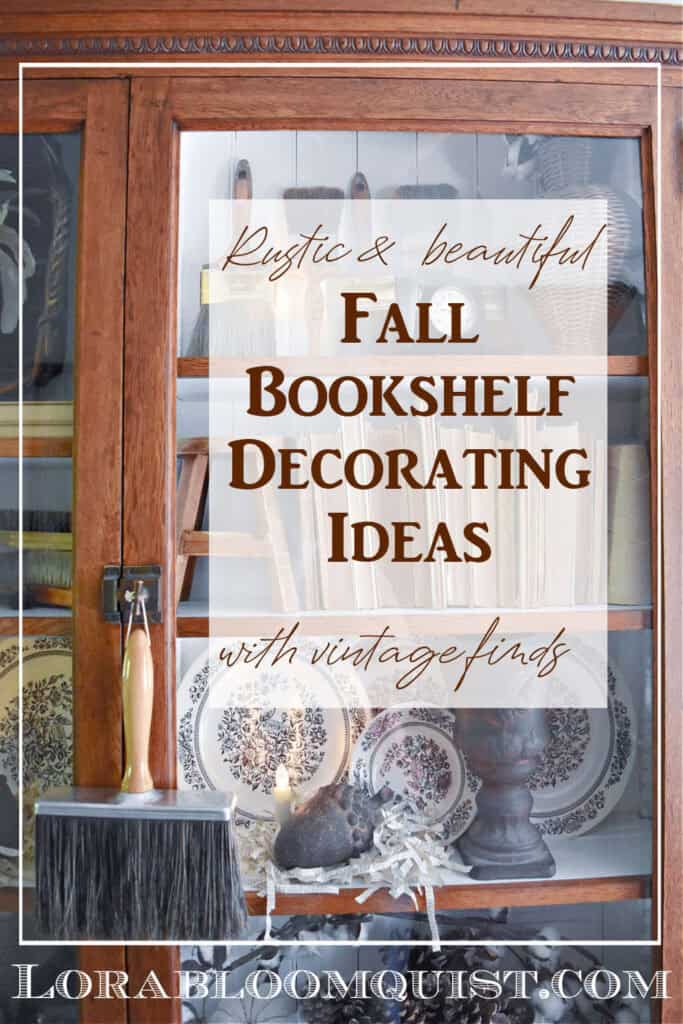 Glass cabinet Fall bookshelf display with old books, transferware and vintage paintbrushes.