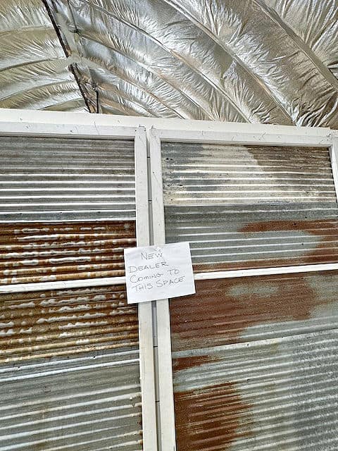 Old tin roofing in shop display.