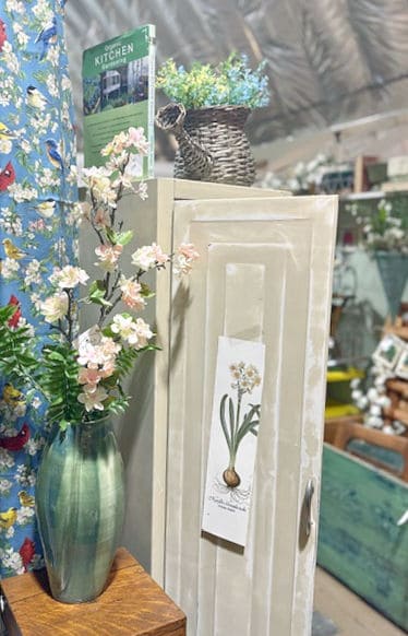 Vintage white metal cupboard in vintage booth.