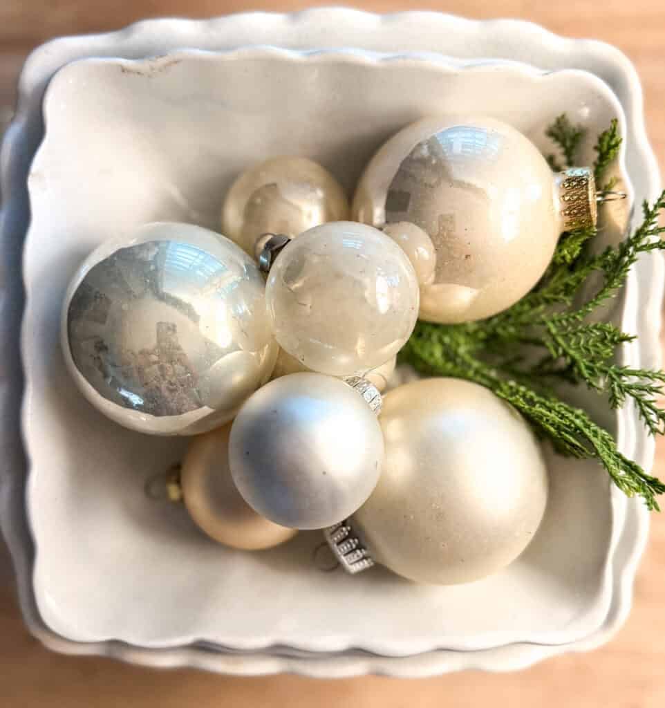 White Christmas ornaments in bowl