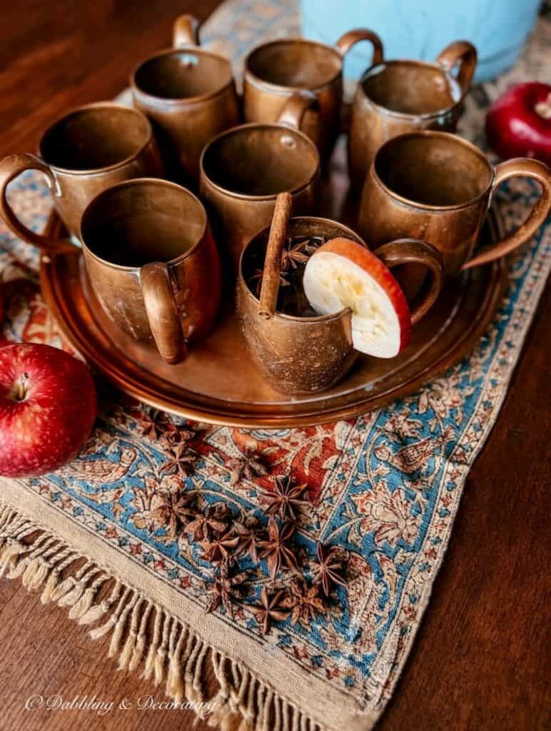 Vintage copper mugs on tray