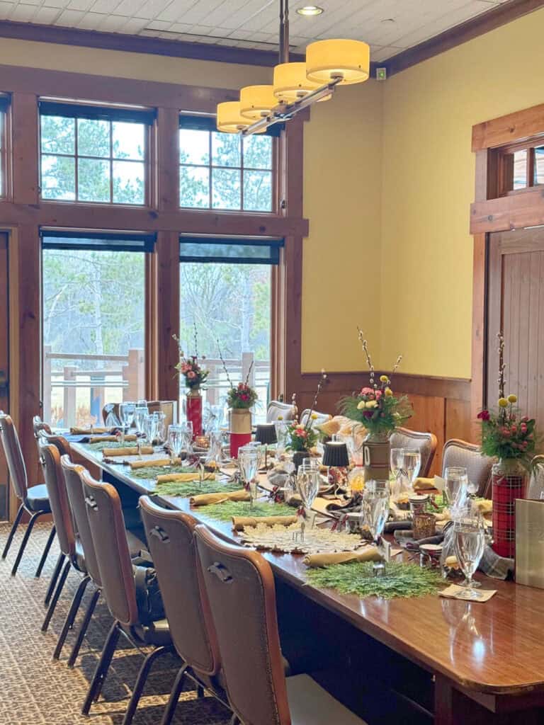 Long table with cabin birthday party theme.