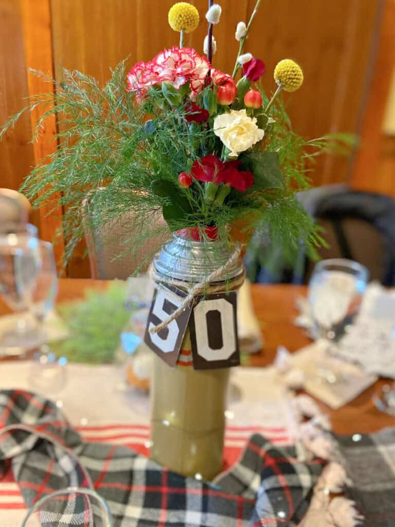 Vintage thermos flower arrangement as centerpiece