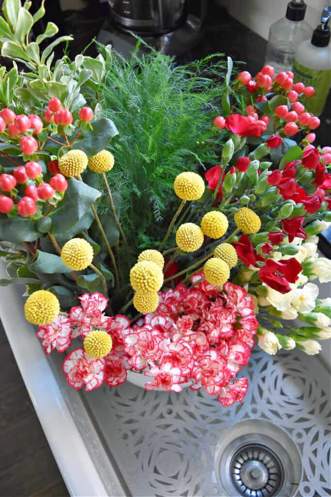 Fresh store flowers in sink.