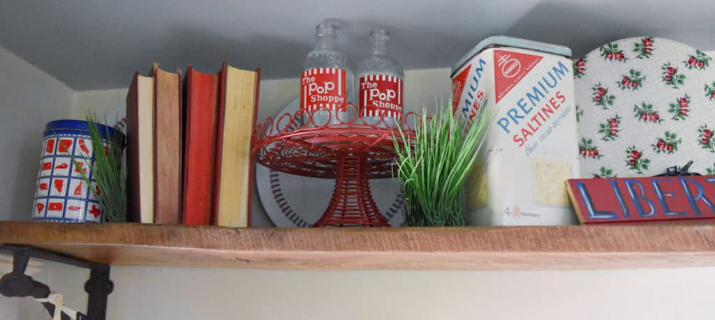 Red, white and blue americana vintage finds as patriotic decor display.