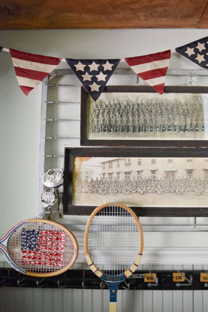 Yard long military photos and red white and blue patriotic garland as decor.