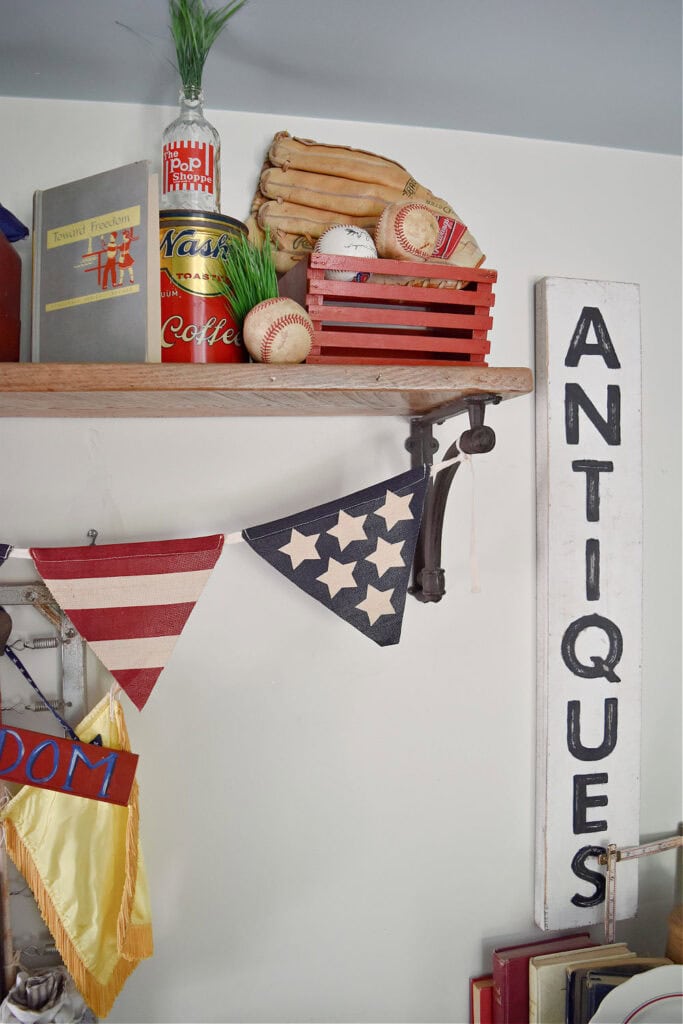 Red, white and blue americana vintage finds as patriotic decor display.