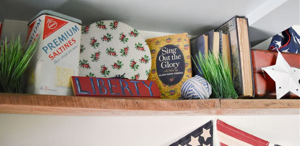 Red, white and blue americana vintage finds as patriotic decor display.