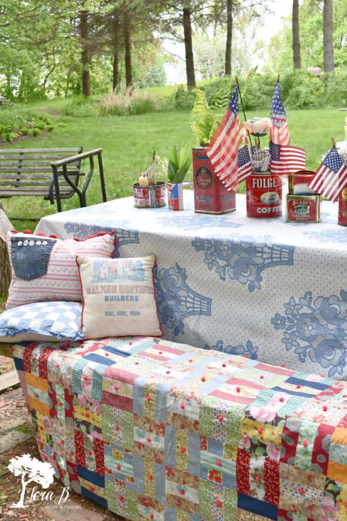 Vintage quilt and bedspread on picnic table