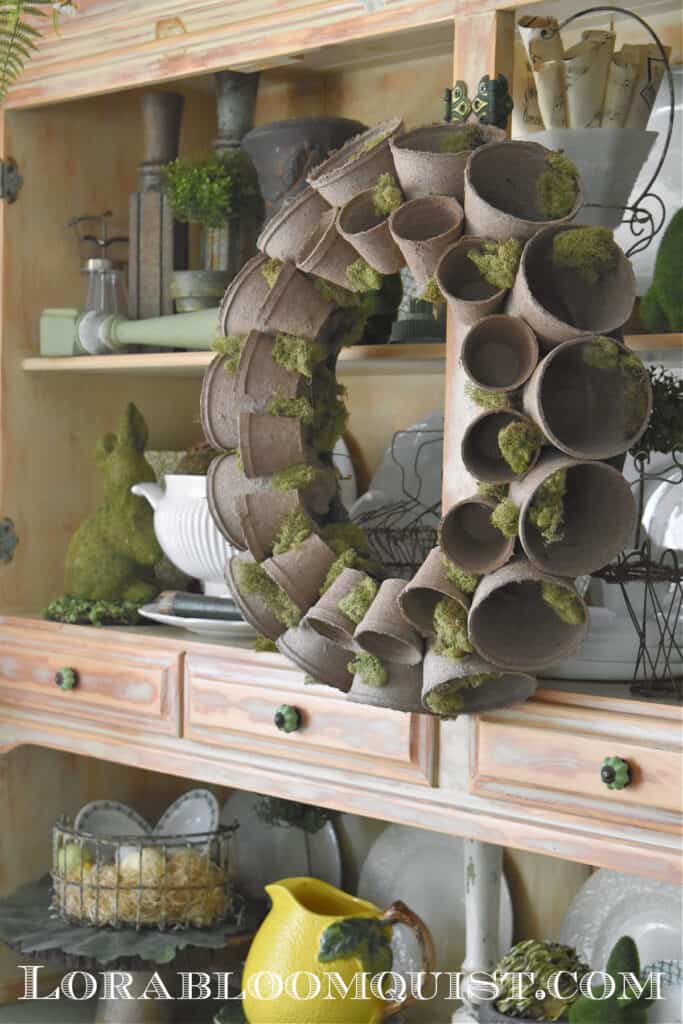 DIY peat pot wreath on Spring hutch