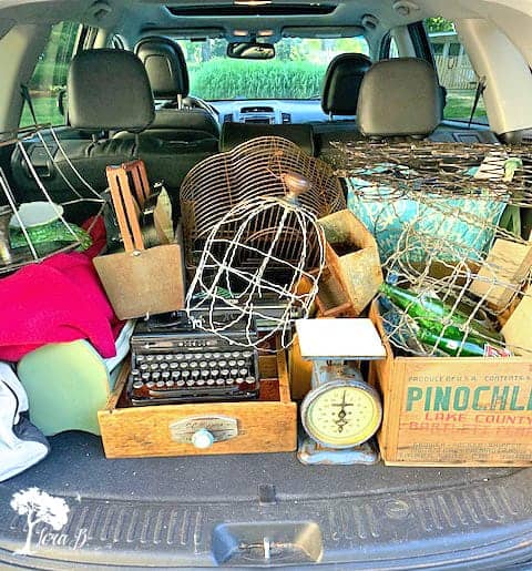 Trunkload of vintage props for photo styling tips using vintage and flowers