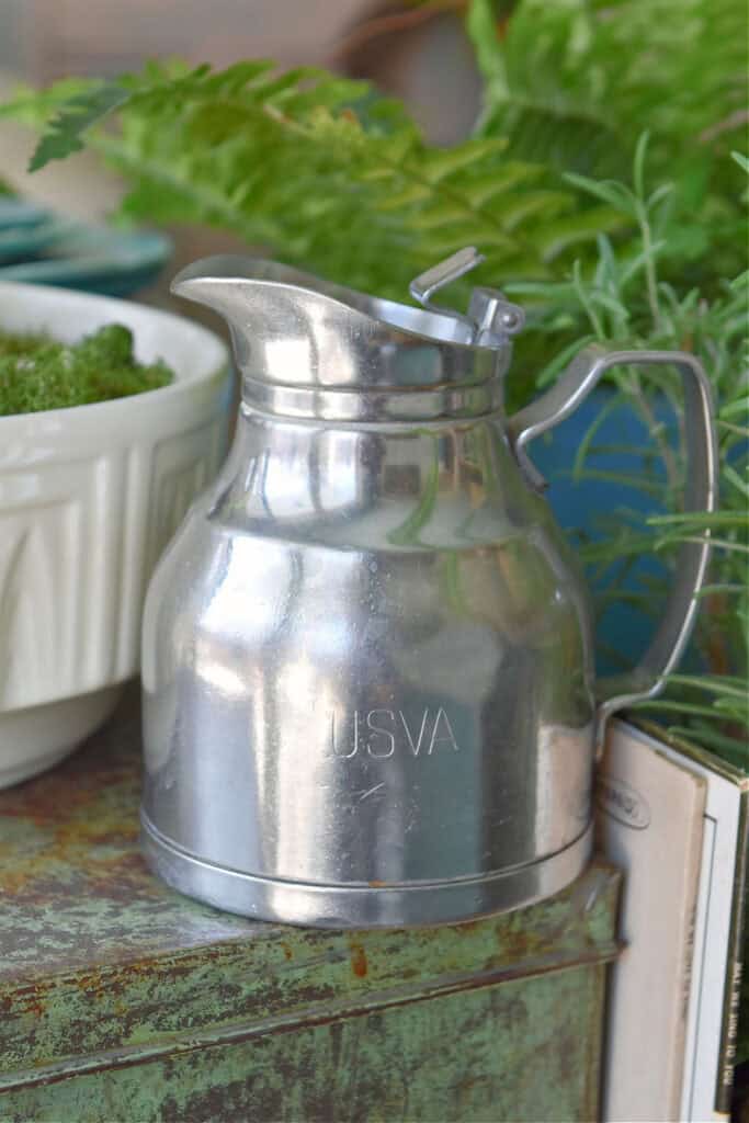 Small metal pitcher.