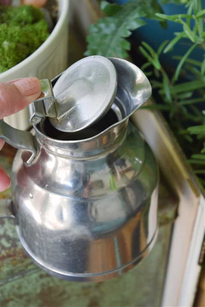 Small metal pitcher.