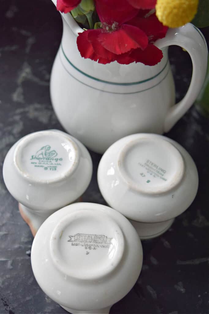 Maker stamps on vintage restaurant ware creamers.