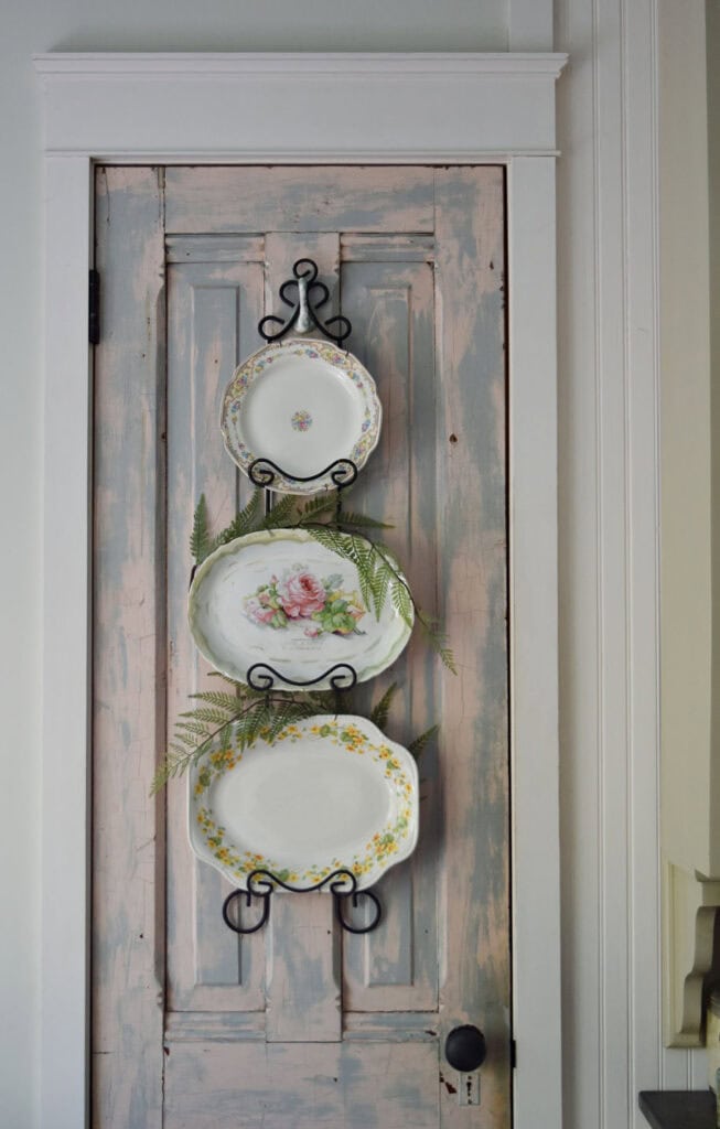 Floral themed plates decorating a plate rack