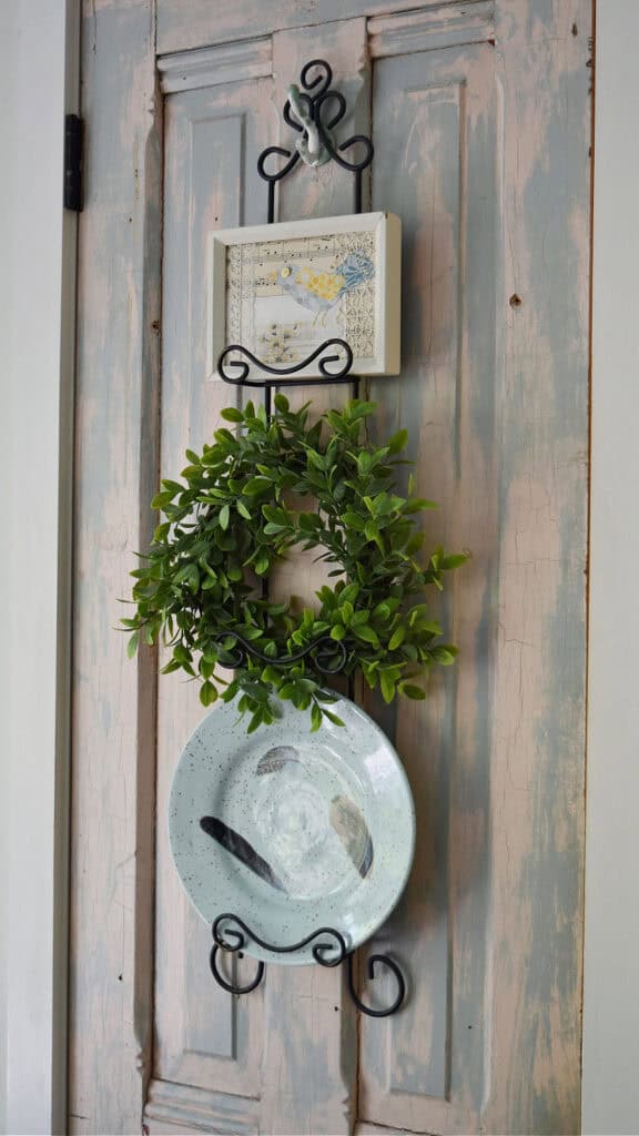 Bird themed accessories decorating a plate rack.