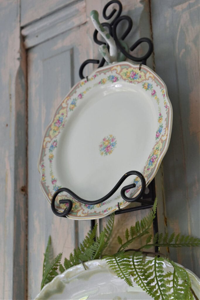 Pretty flowered plate in plate rack.