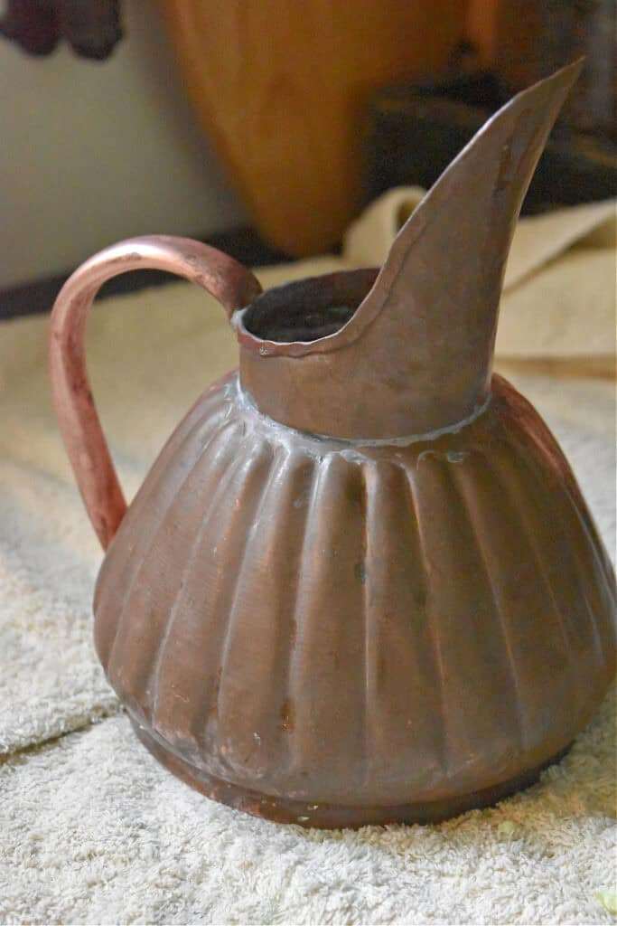 Copper watering can.