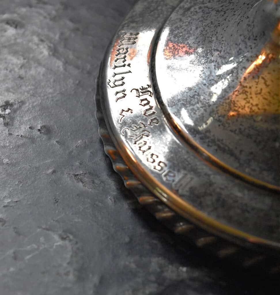 Engraved names on silver.