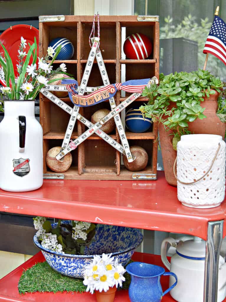 Folding ruler measuring star and vintage finds on Patriotic porch.