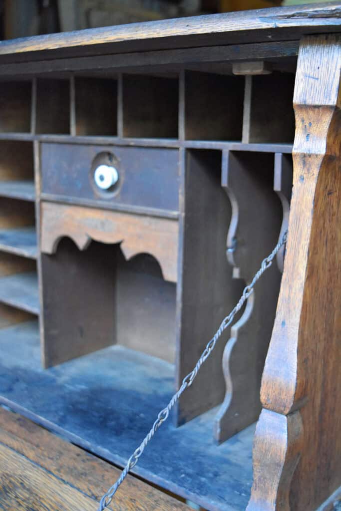 Antique desk with compartments and pull down.