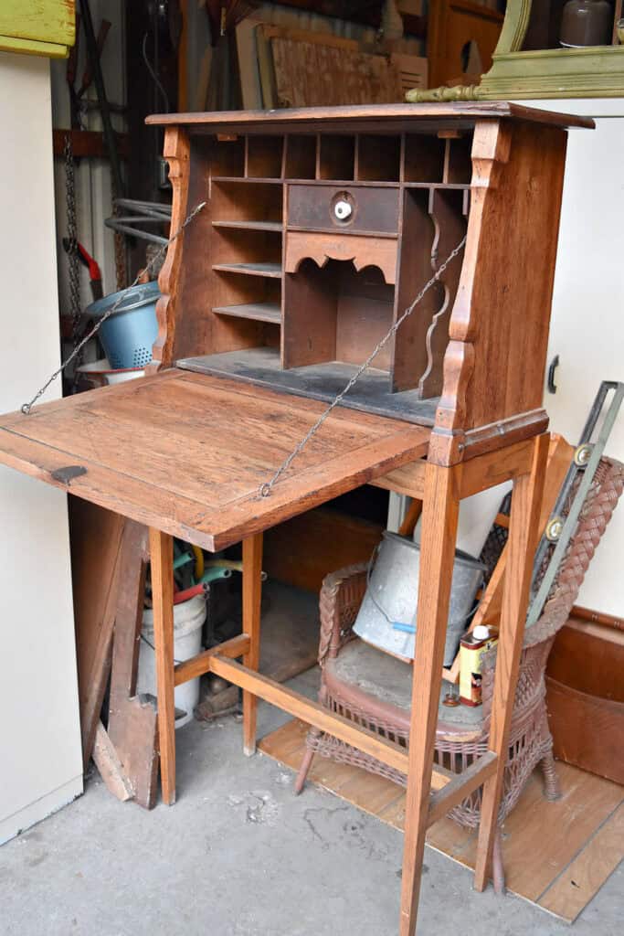 Antique wooden standing desk with cubbies.