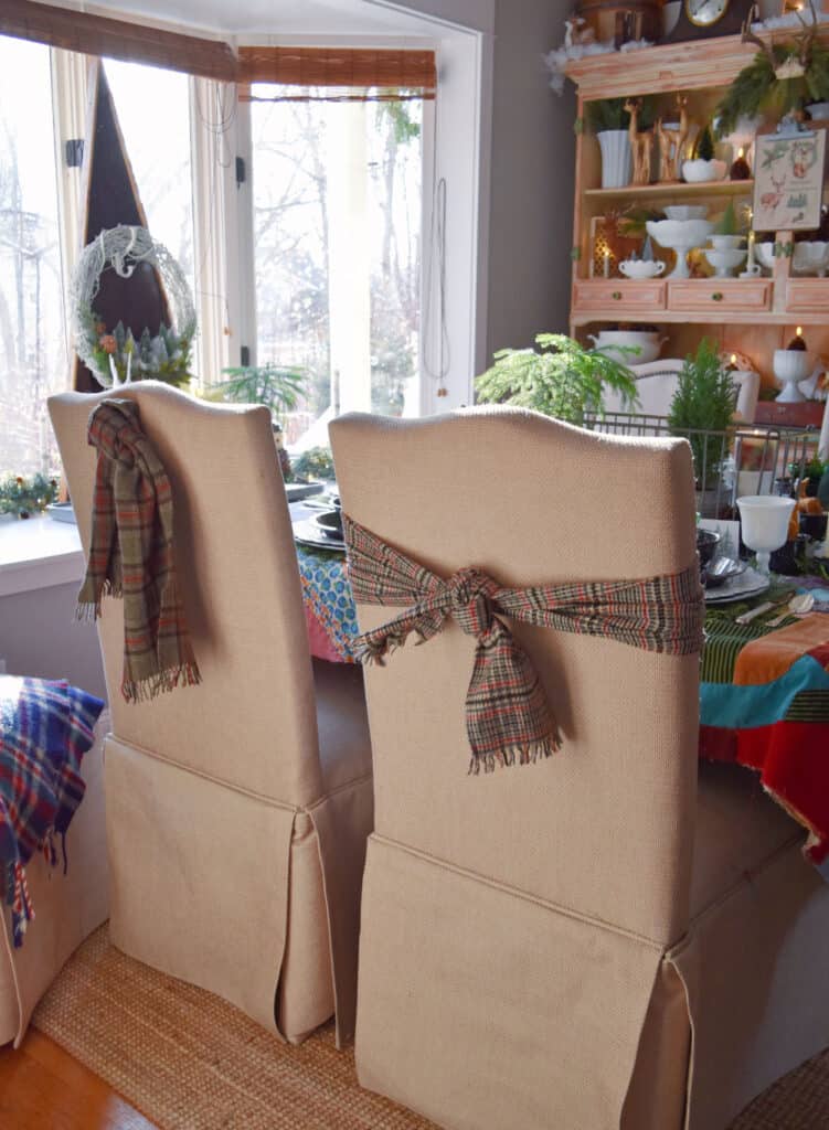 Winter scarves as decor in Christmas decorated dining room.