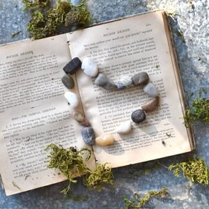 Rock heart and old book.