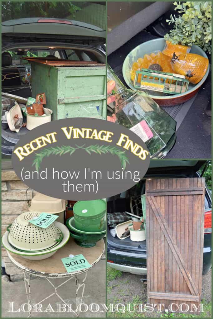 Vintage finds in back of car: green trunk, old wood door, enamelware and sunflower candles.