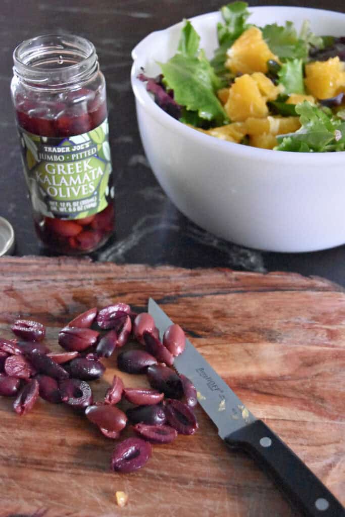 Cutting black olives.