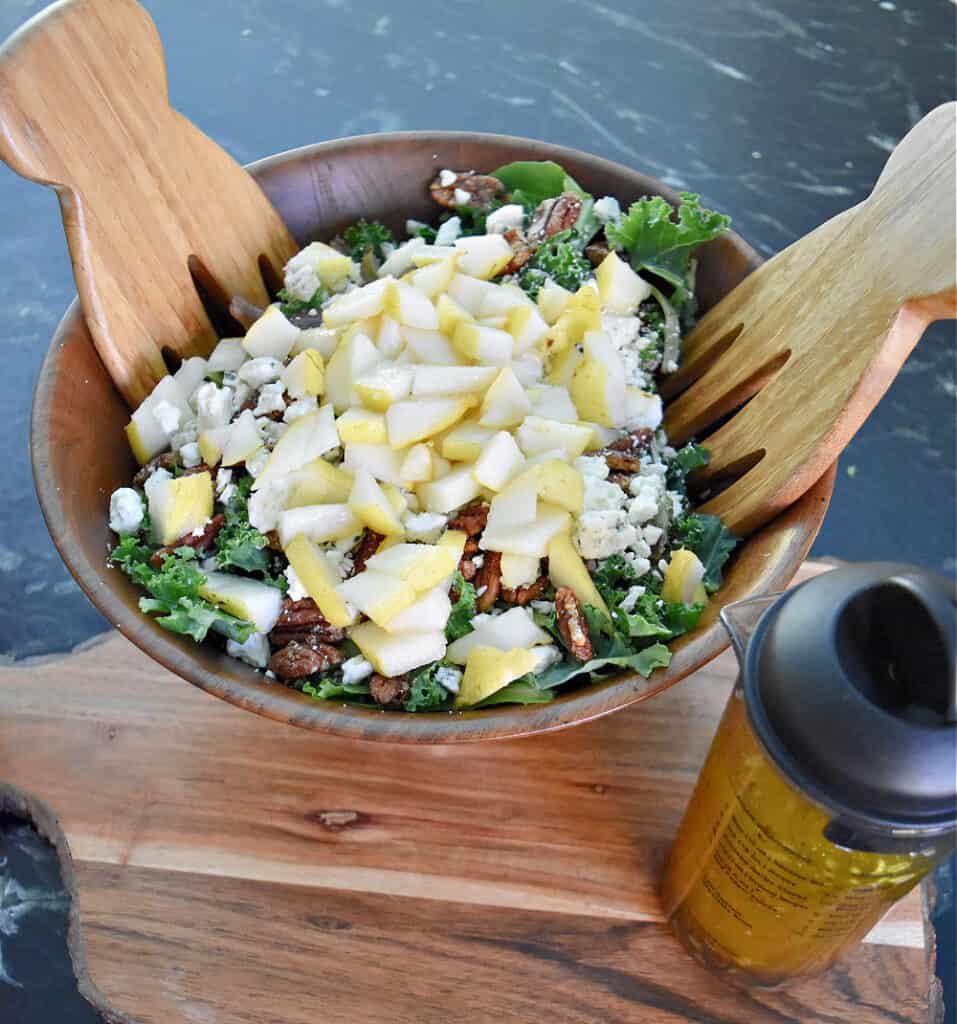 Pear Gorgonzola salad in wooden bowl.