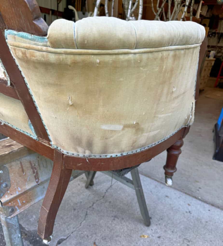 Refreshing an antique velvet settee.