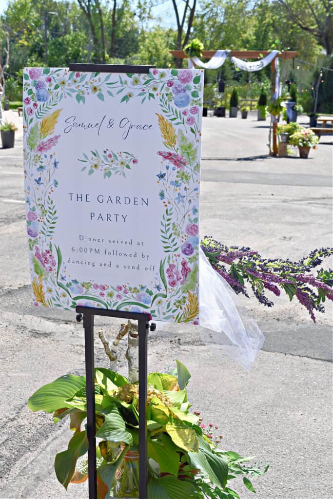 Garden party wedding sign at reception.