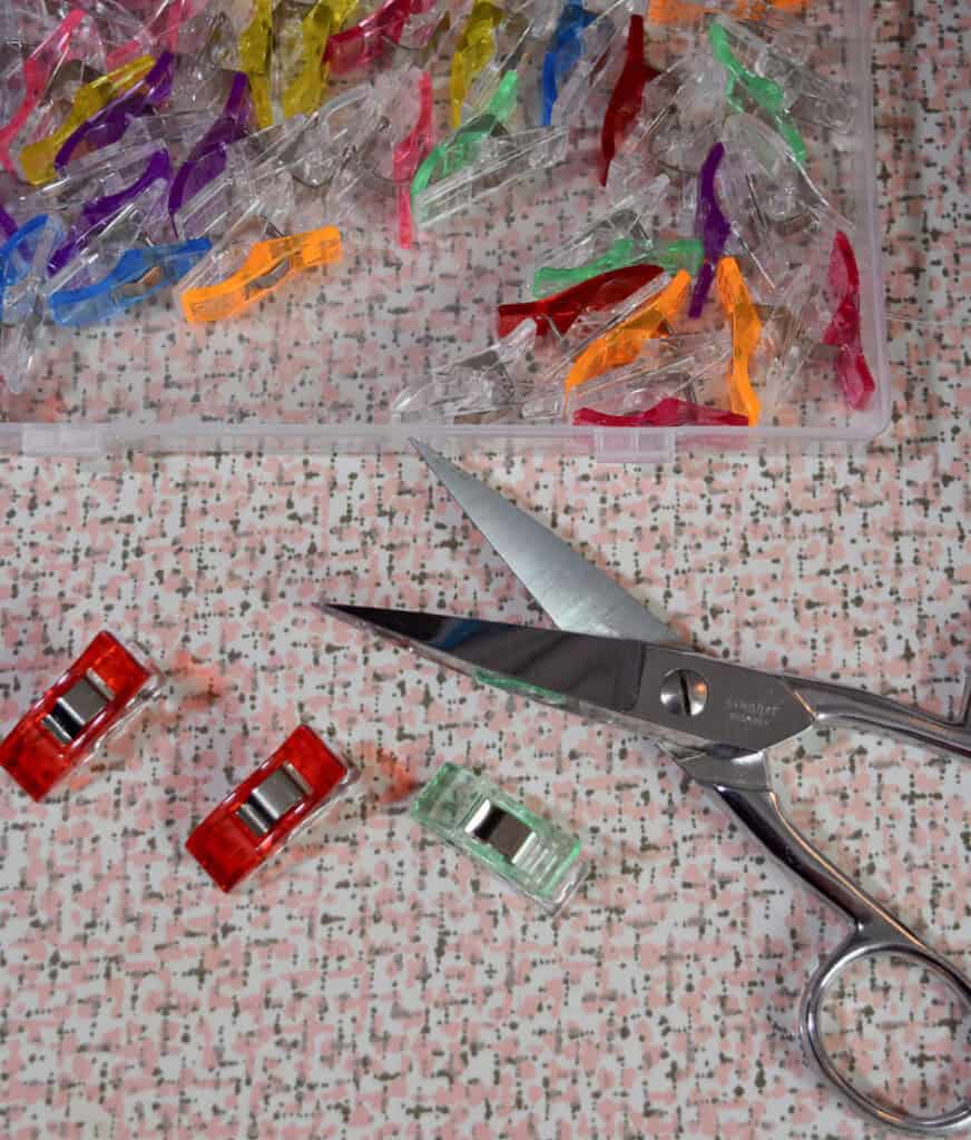 Gingher scissors and clips for sewing.