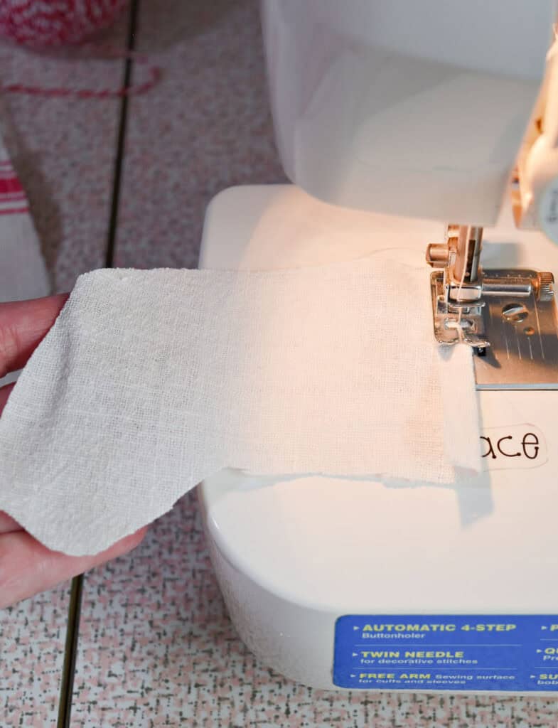 Crafting mini scrap fabric Christmas stocking.