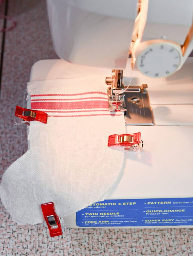 Crafting mini scrap fabric Christmas stocking.