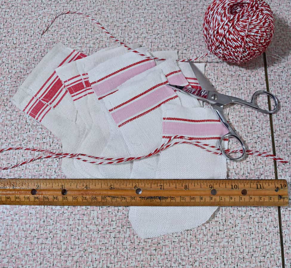 Crafting mini scrap fabric Christmas stocking.