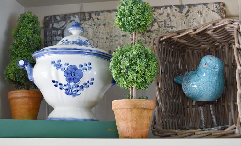 Blue and white soup tureen and topiary home decor