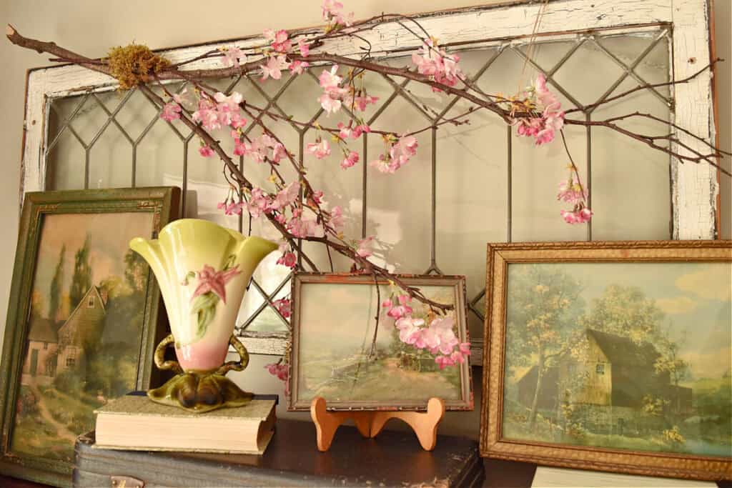 Faux apple blossoms on branch as Spring decor.