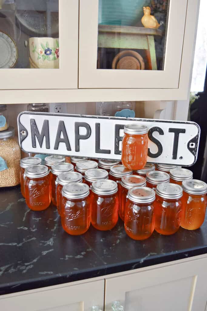 Homemade maple syrup in pint jars.