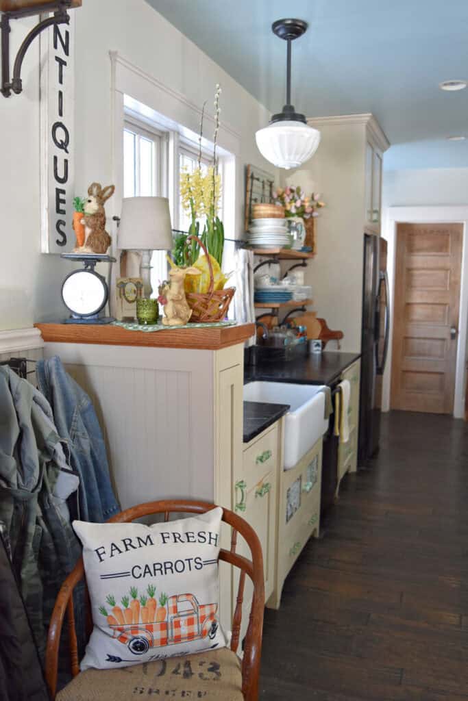 Farmhouse kitchen decorated for Spring with cottage style.