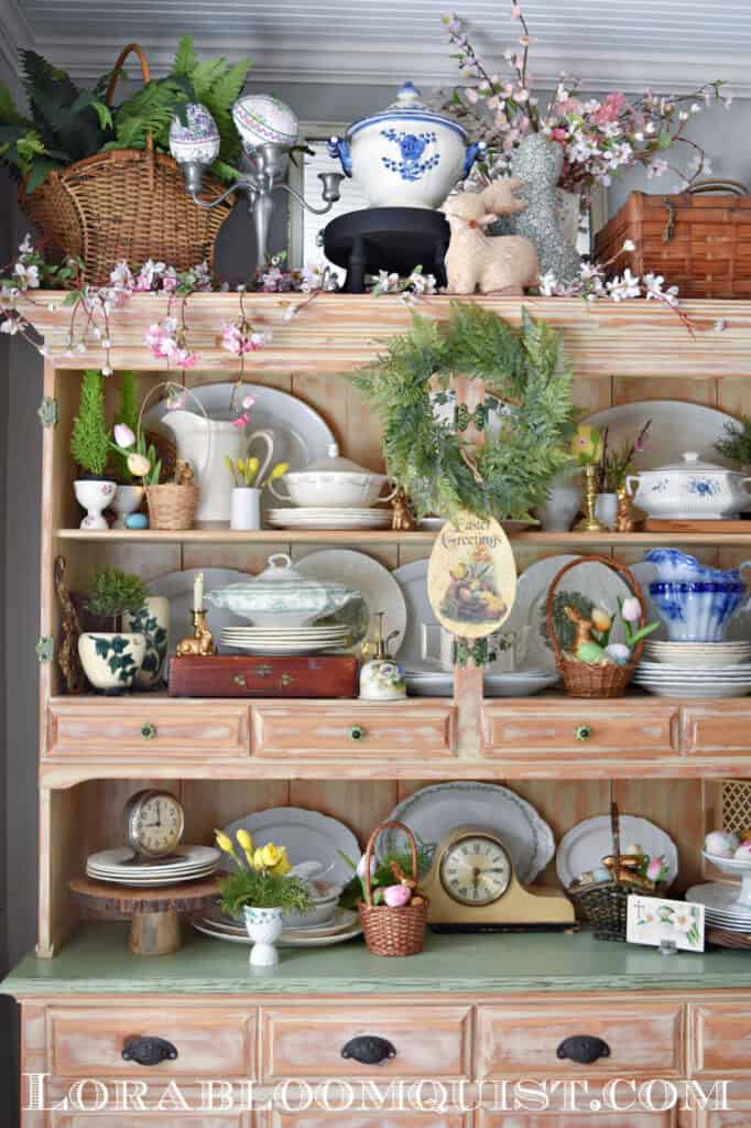 Beautiful Spring and Easter hutch display with ironstone soup tureens, flowers and eggs.