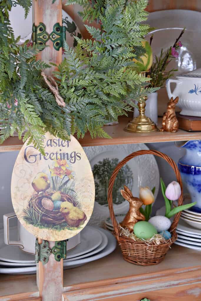 Easter Greetings sign and Spring shelf decor.